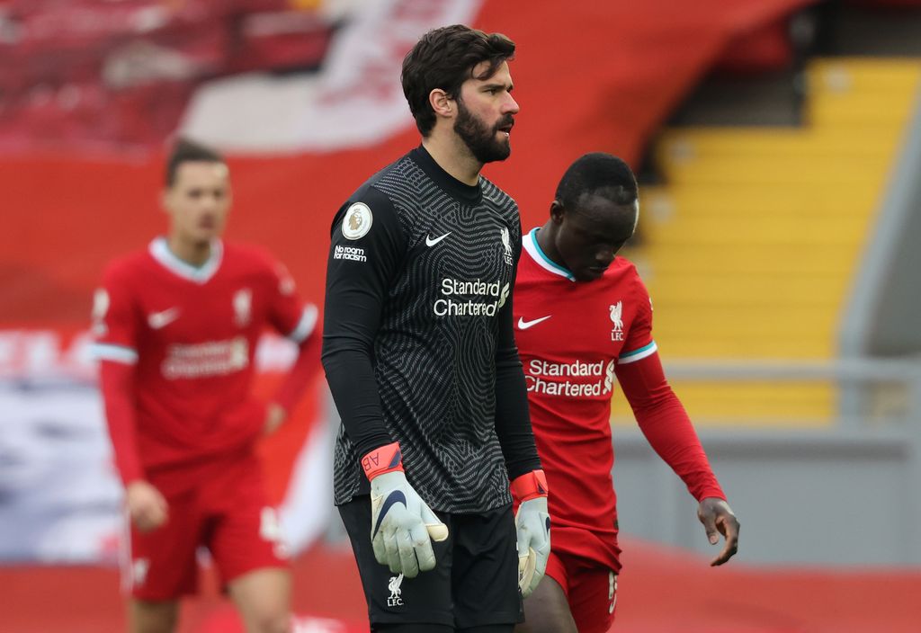 LIVERPOOL, ENGLAND - MARCH 07: Alisson Becker of Liverpool looks dejected following the Premier League match between Liverpool and Fulham at Anfield on March 07, 2021 in Liverpool, England. Sporting stadiums around the UK remain under strict restrictions due to the Coronavirus Pandemic as Government social distancing laws prohibit fans inside venues resulting in games being played behind closed doors. (Photo by Clive Brunskill/Getty Images)