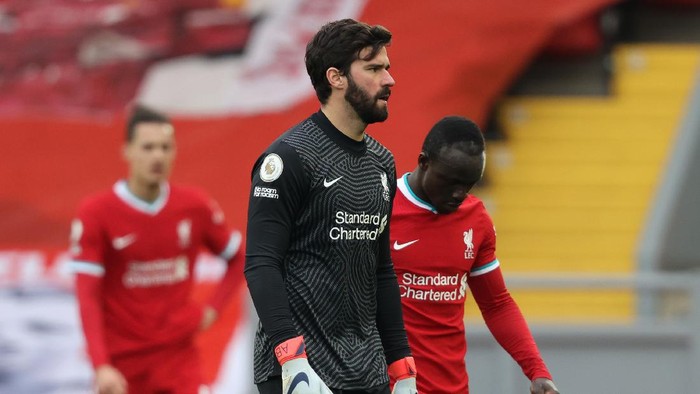 LIVERPOOL, ENGLAND - MARCH 07: Alisson Becker of Liverpool looks dejected following the Premier League match between Liverpool and Fulham at Anfield on March 07, 2021 in Liverpool, England. Sporting stadiums around the UK remain under strict restrictions due to the Coronavirus Pandemic as Government social distancing laws prohibit fans inside venues resulting in games being played behind closed doors. (Photo by Clive Brunskill/Getty Images)
