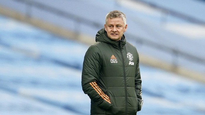Manchester Uniteds manager Ole Gunnar Solskjaer stands by the touchline during the English Premier League soccer match between Manchester City and Manchester United at the Etihad Stadium in Manchester, England, Sunday, March 7, 2021. (Dave Thompson/Pool via AP)