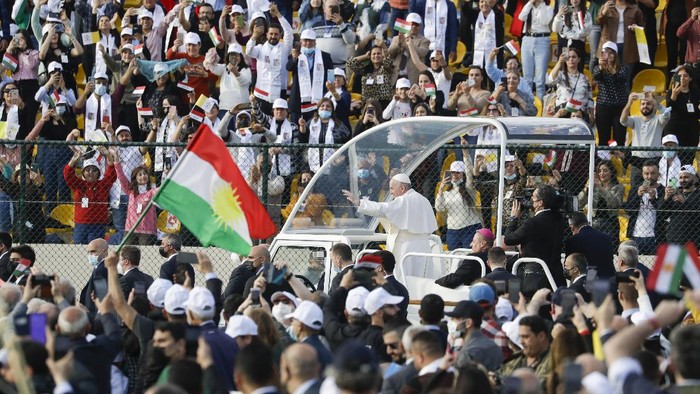 Pope Francis arrives on the popemobile to celebrate mass at the Franso Hariri Stadium in Irbil, Kurdistan Region of Iraq, Sunday, March 7, 2021. The Vatican and the pope have frequently insisted on the need to preserve Iraqs ancient Christian communities and create the security, economic and social conditions for those who have left to return.(AP Photo/Andrew Medichini)