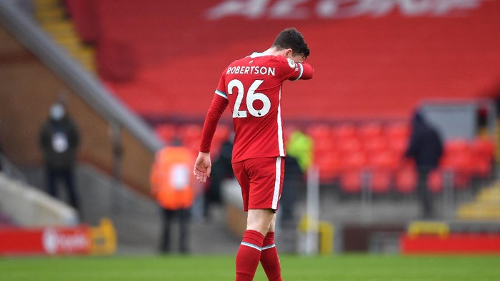 LIVERPOOL, ENGLAND - MARCH 07: Andy Robertson of Liverpool looks dejected following the Premier League match between Liverpool and Fulham at Anfield on March 07, 2021 in Liverpool, England. Sporting stadiums around the UK remain under strict restrictions due to the Coronavirus Pandemic as Government social distancing laws prohibit fans inside venues resulting in games being played behind closed doors. (Photo by Paul Ellis - Pool/Getty Images)