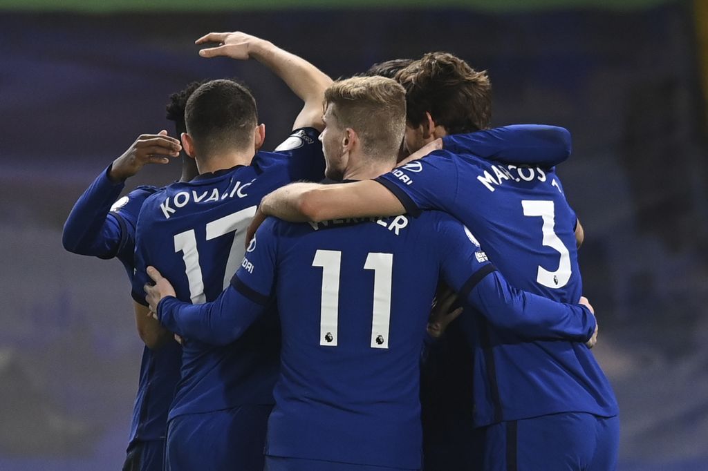Chelsea players celebrate after Everton's Ben Godfrey scored an own goal during the English Premier League soccer match between Chelsea and Everton at the Stamford Bridge stadium in London, Monday, March 8, 2021. (Glyn Kirk/Pool via AP)