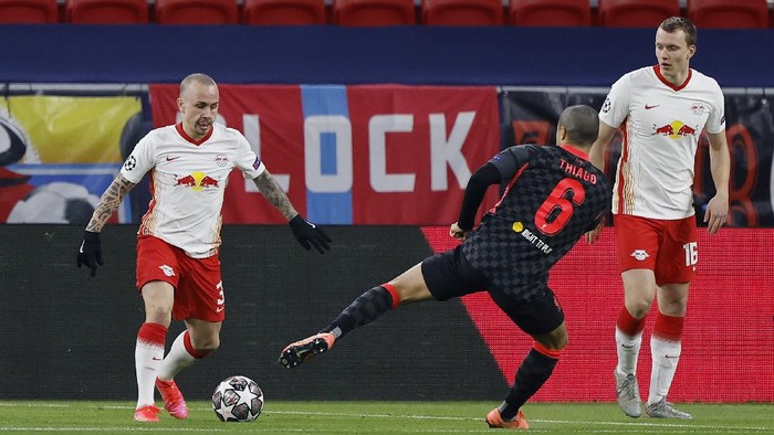 BUDAPEST, HUNGARY - FEBRUARY 16: Angelino of RB Leipzig is challenged by Thiago of Liverpool during the UEFA Champions League Round of 16 match between RB Leipzig and Liverpool FC at Puskas Arena on February 16, 2021 in Budapest, Hungary. Liverpool face RB Leipzig at a neutral venue in Budapest behind closed doors after Germany imposed a ban on travellers arriving from the UK in an effort to prevent the spread of Covid-19 variants. (Photo by Laszlo Szirtesi/Getty Images)