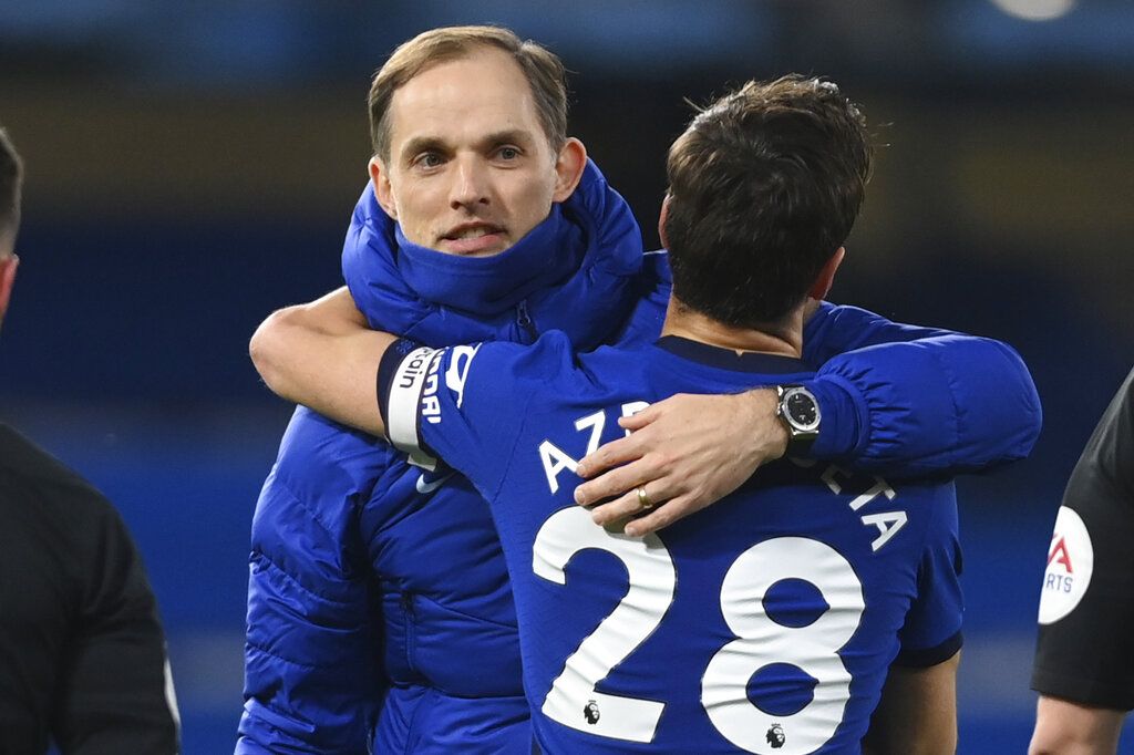 Chelsea's head coach Thomas Tuchel embraces Chelsea's Cesar Azpilicueta at the end of the English Premier League soccer match between Chelsea and Everton at the Stamford Bridge stadium in London, Monday, March 8, 2021. (Mike Hewitt/Pool via AP)