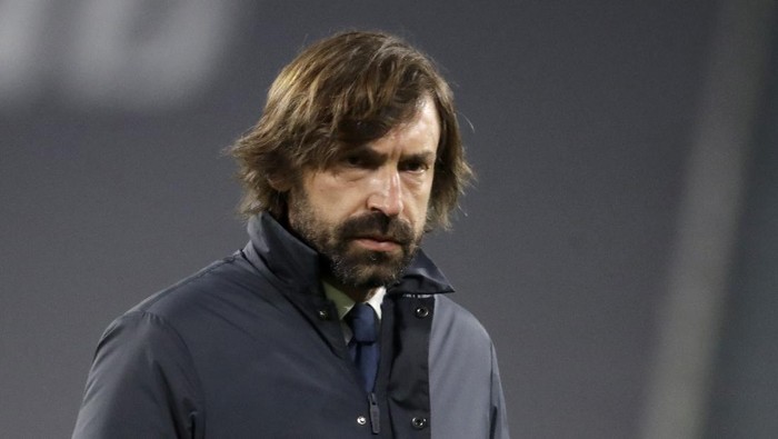 Juventus head coach Andrea Pirlo walks on the pitch during warmup before the Champions League, round of 16, second leg, soccer match between Juventus and Porto in Turin, Italy, Tuesday, March 9, 2021. (AP Photo/Luca Bruno)