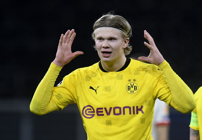 Dortmund's Erling Haaland celebrates after scoring his sides first goal during the Champions League, round of 16, second leg soccer match between Borussia Dortmund and Sevilla FC in Dortmund, Germany, Tuesday, March 9, 2021. (Bernd Thissen/Pool via AP)