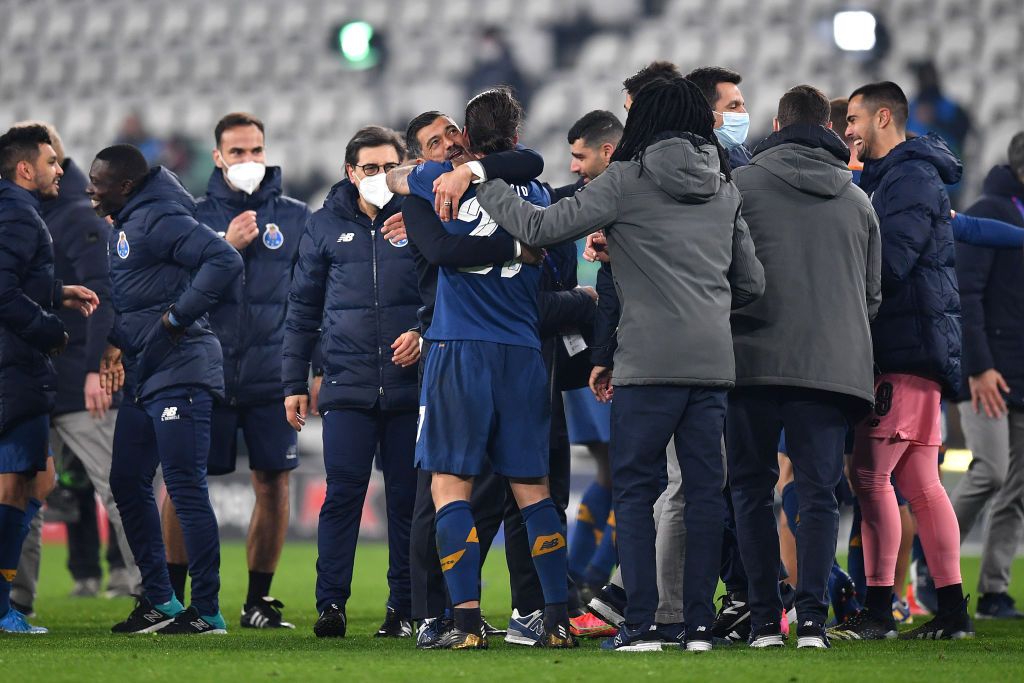 TURIN, ITALY - MARCH 09: Sergio Oliveira of Porto celebrates victory with Sergio Conceicao, Head Coach of Porto after the UEFA Champions League Round of 16 match between Juventus and FC Porto at Juventus Arena on March 09, 2021 in Turin, Italy. Sporting stadiums around Italy remain under strict restrictions due to the Coronavirus Pandemic as Government social distancing laws prohibit fans inside venues resulting in games being played behind closed doors. (Photo by Valerio Pennicino/Getty Images)