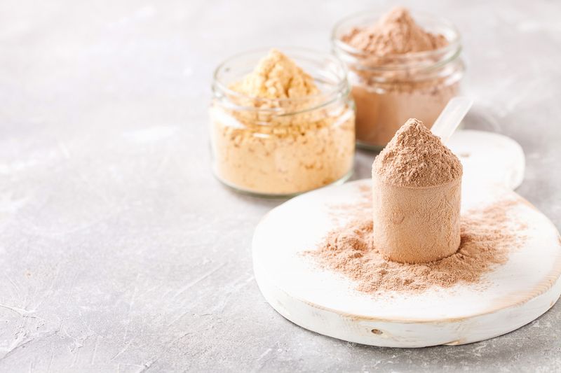 Ilustrasi Bubuk Protein Selective protein in powder for sports food. Fitness food. Selective focus. Copy space