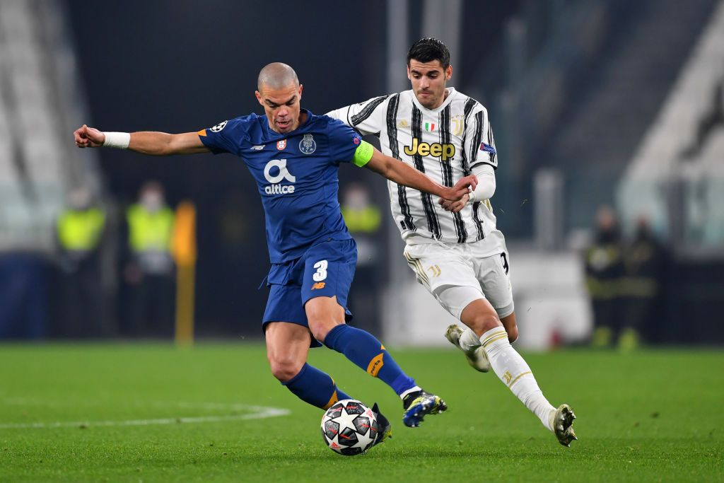 TURIN, ITALY - MARCH 09: Pepe of Porto battles for possession with Alvaro Morata of Juventus during the UEFA Champions League Round of 16 match between Juventus and FC Porto at Juventus Arena on March 09, 2021 in Turin, Italy. Sporting stadiums around Italy remain under strict restrictions due to the Coronavirus Pandemic as Government social distancing laws prohibit fans inside venues resulting in games being played behind closed doors. (Photo by Valerio Pennicino/Getty Images)
