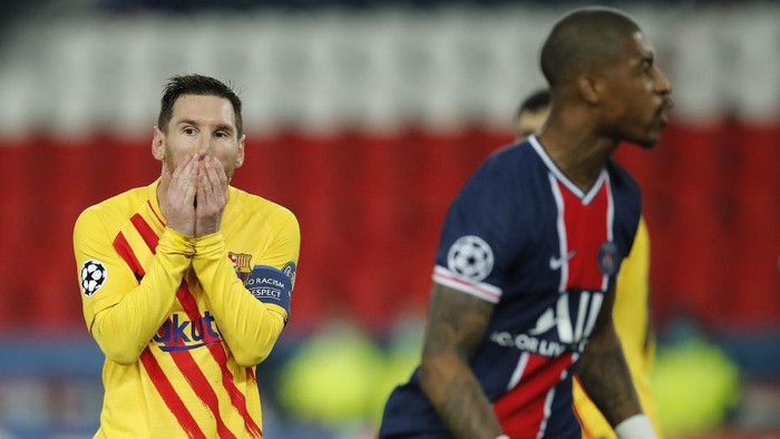 Barcelonas Lionel Messi reacts after a missed a penalty shot during the Champions League, round of 16, second leg soccer match between Paris Saint-Germain and FC Barcelona at the Parc des Princes stadium in Paris, Wednesday, March 10, 2021. (AP Photo/Christophe Ena)
