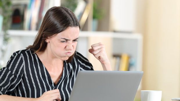 cyber bullying concept. people using notebook computer laptop for social media interactions with notification icons of hate speech and mean comment in social network