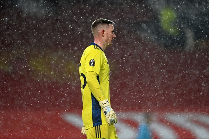 MANCHESTER, ENGLAND - MARCH 11: Dean Henderson of Manchester United looks on as rain falls during the UEFA Europa League Round of 16 First Leg match between Manchester United and A.C. Milan at Old Trafford on March 11, 2021 in Manchester, England. Sporting stadiums around the UK remain under strict restrictions due to the Coronavirus Pandemic as Government social distancing laws prohibit fans inside venues resulting in games being played behind closed doors. (Photo by Laurence Griffiths/Getty Images)