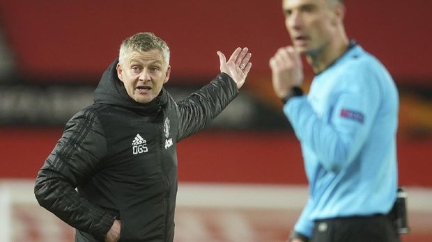 Manchester United's manager Ole Gunnar Solskjaer reacts during the Europa League round of 16 first leg soccer match between Manchester United and AC Milan at Old Trafford in Manchester, England, Thursday, March 11, 2021. (AP Photo/Dave Thompson)