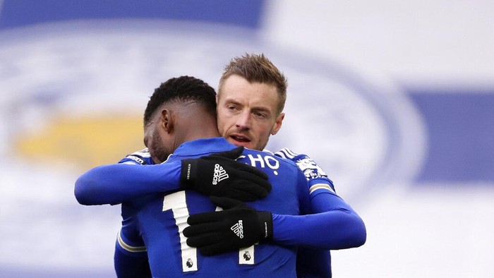Leicesters Kelechi Iheanacho celebrates with Jamie Vardy, right, after scoring the opening goal during the English Premier League soccer match between Leicester City and Sheffield United at the King Power Stadium in Leicester, England, Sunday, March 14, 2021. (Alex Pantling/Pool via AP)