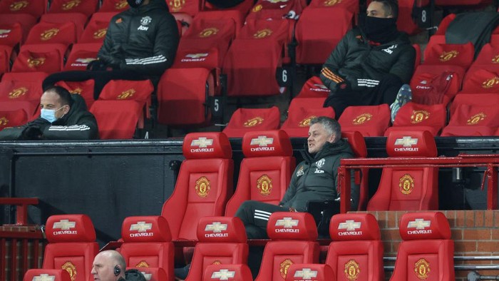 MANCHESTER, ENGLAND - MARCH 14: Ole Gunnar Solskjaer, Manager of Manchester United reacts from the dugout during the Premier League match between Manchester United and West Ham United at Old Trafford on March 14, 2021 in Manchester, England. Sporting stadiums around the UK remain under strict restrictions due to the Coronavirus Pandemic as Government social distancing laws prohibit fans inside venues resulting in games being played behind closed doors. (Photo by Clive Brunskill/Getty Images)