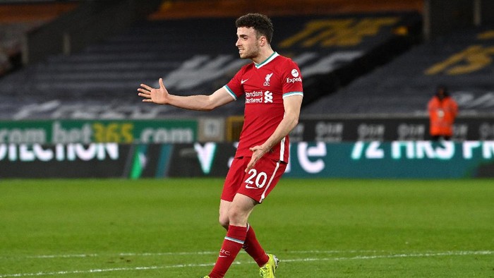 WOLVERHAMPTON, ENGLAND - MARCH 15: Diogo Jota of Liverpool celebrates after scoring their sides first goal during the Premier League match between Wolverhampton Wanderers and Liverpool at Molineux on March 15, 2021 in Wolverhampton, England. Sporting stadiums around the UK remain under strict restrictions due to the Coronavirus Pandemic as Government social distancing laws prohibit fans inside venues resulting in games being played behind closed doors. (Photo by Paul Ellis - Pool/Getty Images)