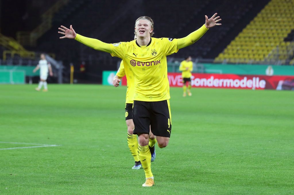 DORTMUND, GERMANY - FEBRUARY 02: Erling Haaland of Borussia Dortmund celebrates after scoring their side's third goal during the DFB Cup Round of Sixteen match between Borussia Dortmund and SC Paderborn 07 at Signal Iduna Park on February 02, 2021 in Dortmund, Germany. Sporting stadiums around Germany remain under strict restrictions due to the Coronavirus Pandemic as Government social distancing laws prohibit fans inside venues resulting in games being played behind closed doors. (Photo by Friedemann Vogel - Pool/Getty Images)