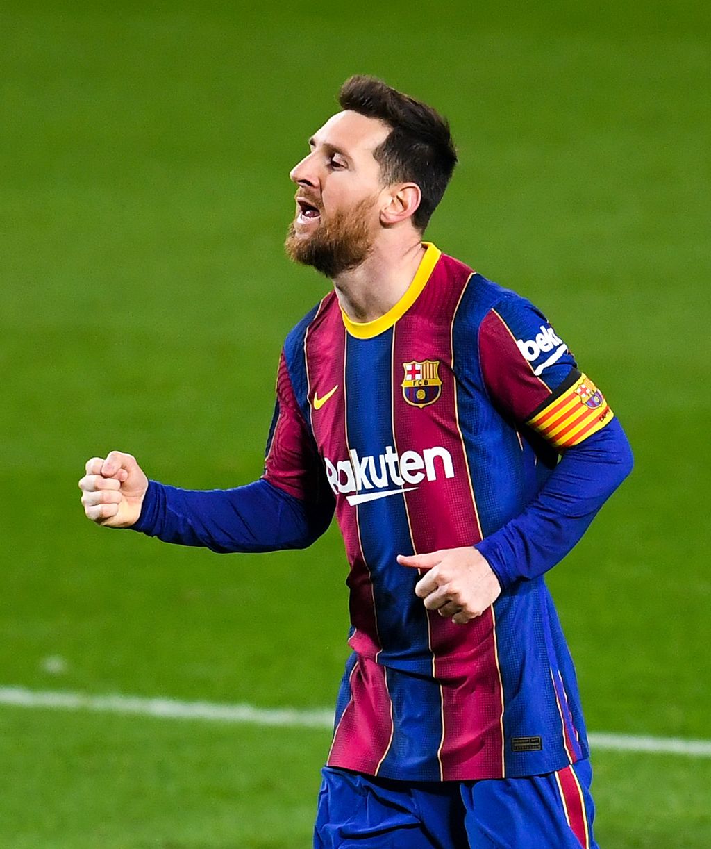 BARCELONA, SPAIN - MARCH 15: Lionel Messi of FC Barcelona celebrates after scoring his team's fourth goal during the La Liga Santander match between FC Barcelona and SD Huesca at Camp Nou on March 15, 2021 in Barcelona, Spain. Sporting stadiums around Spain remain under strict restrictions due to the Coronavirus Pandemic as Government social distancing laws prohibit fans inside venues resulting in games being played behind closed doors. (Photo by David Ramos/Getty Images)