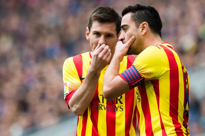 BARCELONA, SPAIN - MARCH 29: Lionel Messi (L) and Xavi Hernandez of FC Barcelona speak during the La Liga match between RCD Espanyol and FC Barcelona at Cornella-El Prat Stadium on March 29, 2014 in Barcelona, Spain. (Photo by Alex Caparros/Getty Images)