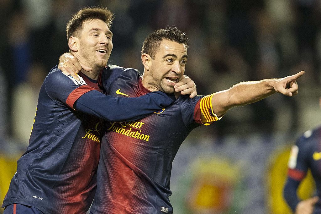 VALLADOLID, SPAIN - DECEMBER 22:  Xavi Hernandez of FC Barcelona celebrates with his teammate Lionel Messi after scoring against Real Valladolid during the La Liga game between Real Valladolid and FC Barcelona at Jose Zorrilla on December 22, 2012 in Valladolid, Spain.  (Photo by Victor Fraile/Getty Images)