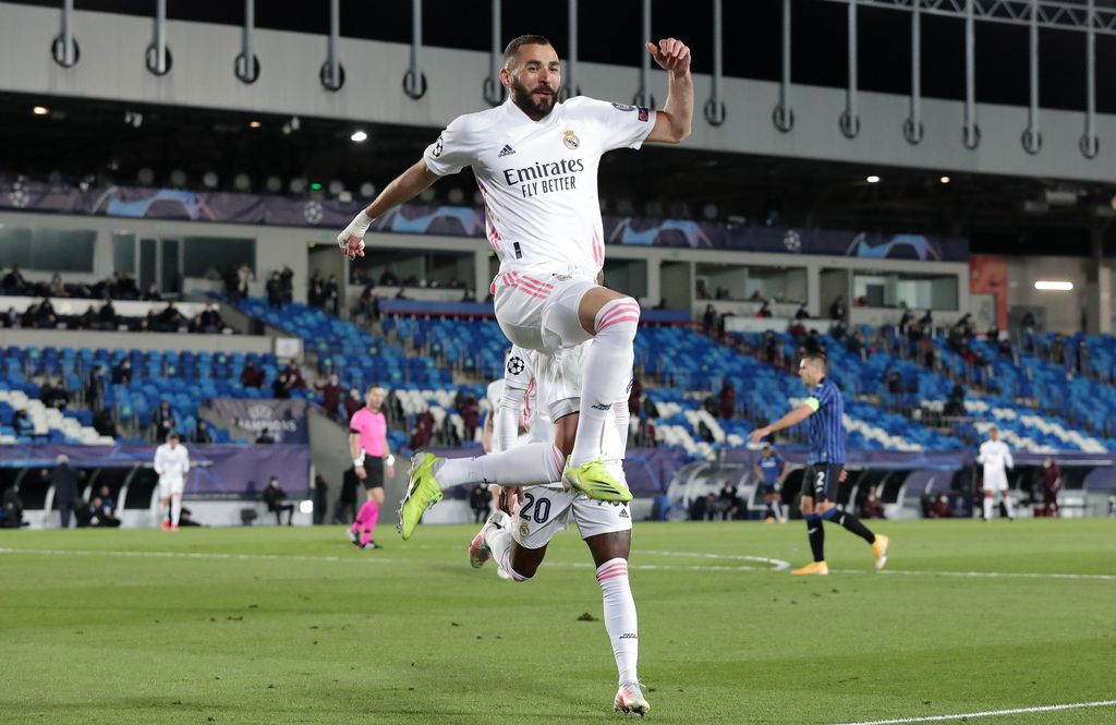 MADRID, SPAIN - MARCH 16: Karim Benzema of Real Madrid celebrates after scoring their side's first goal during the UEFA Champions League Round of 16 match between Real Madrid and Atalanta at Estadio Alfredo Di Stefano on March 16, 2021 in Madrid, Spain. Sporting stadiums around Spain remain under strict restrictions due to the Coronavirus Pandemic as Government social distancing laws prohibit fans inside venues resulting in games being played behind closed doors. (Photo by Gonzalo Arroyo Moreno/Getty Images)