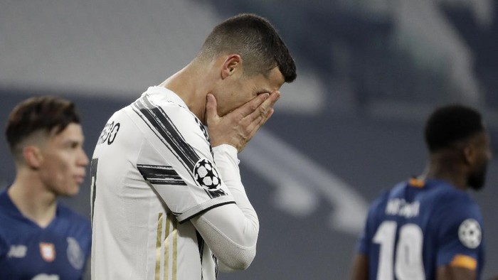 FILE - In this Tuesday, March 9, 2021 file photo Juventus Cristiano Ronaldo reacts during the Champions League, round of 16, second leg, soccer match between Juventus and Porto in Turin, Italy. Neither Lionel Messi nor Cristiano Ronaldo will be in the Champions League quarterfinals for the first time since 2005. The two greatest players of the current generation were both eliminated from the competition this week. Messi scored a goal but missed a penalty as Barcelona was eliminated by Paris Saint-Germain. Ronaldo and his Juventus teammates were ousted by Porto the night before. Ronaldo has won five Champions League titles in his career. Messi has won four.  (AP Photo/Luca Bruno, File)