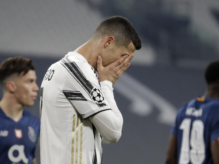 FILE - In this Tuesday, March 9, 2021 file photo Juventus' Cristiano Ronaldo reacts during the Champions League, round of 16, second leg, soccer match between Juventus and Porto in Turin, Italy. Neither Lionel Messi nor Cristiano Ronaldo will be in the Champions League quarterfinals for the first time since 2005. The two greatest players of the current generation were both eliminated from the competition this week. Messi scored a goal but missed a penalty as Barcelona was eliminated by Paris Saint-Germain. Ronaldo and his Juventus teammates were ousted by Porto the night before. Ronaldo has won five Champions League titles in his career. Messi has won four.  (AP Photo/Luca Bruno, File)