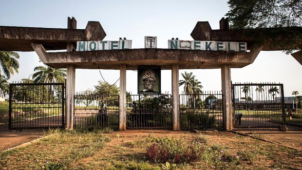 A portrait of the former president of the Democratic Republic of the Congo (former Zaire), Mobutu Sese Seko, hangs at the entrance of his derelict Motel Nzekele, once a five star hotel, on December 3, 2017 in Gbadolite. (Photo by JOHN WESSELS / AFP)