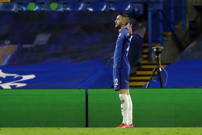 Chelseas Hakim Ziyech celebrates after scoring his sides opening goal during the Champions League, round of 16, second leg soccer match between Chelsea and Atletico Madrid at the Stamford Bridge stadium, London, Wednesday, March 17, 2021. (AP Photo/Matt Dunham)
