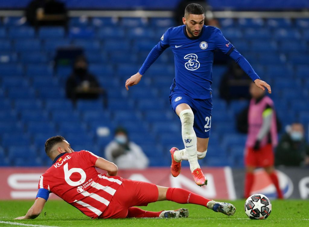 LONDON, ENGLAND - MARCH 17: Hakim Ziyech of Chelsea  is challenged by Koke of Atletico Madrid  during the UEFA Champions League Round of 16 match between Chelsea FC and Atletico Madrid at Stamford Bridge on March 17, 2021 in London, England. Sporting stadiums around the UK remain under strict restrictions due to the Coronavirus Pandemic as Government social distancing laws prohibit fans inside venues resulting in games being played behind closed doors. (Photo by Mike Hewitt/Getty Images)