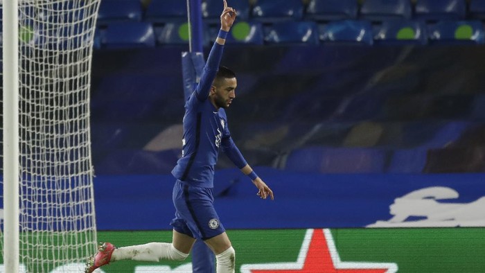Chelseas Hakim Ziyech celebrates after scoring his sides opening goal during the Champions League, round of 16, second leg soccer match between Chelsea and Atletico Madrid at the Stamford Bridge stadium, London, Wednesday, March 17, 2021. (AP Photo/Matt Dunham)