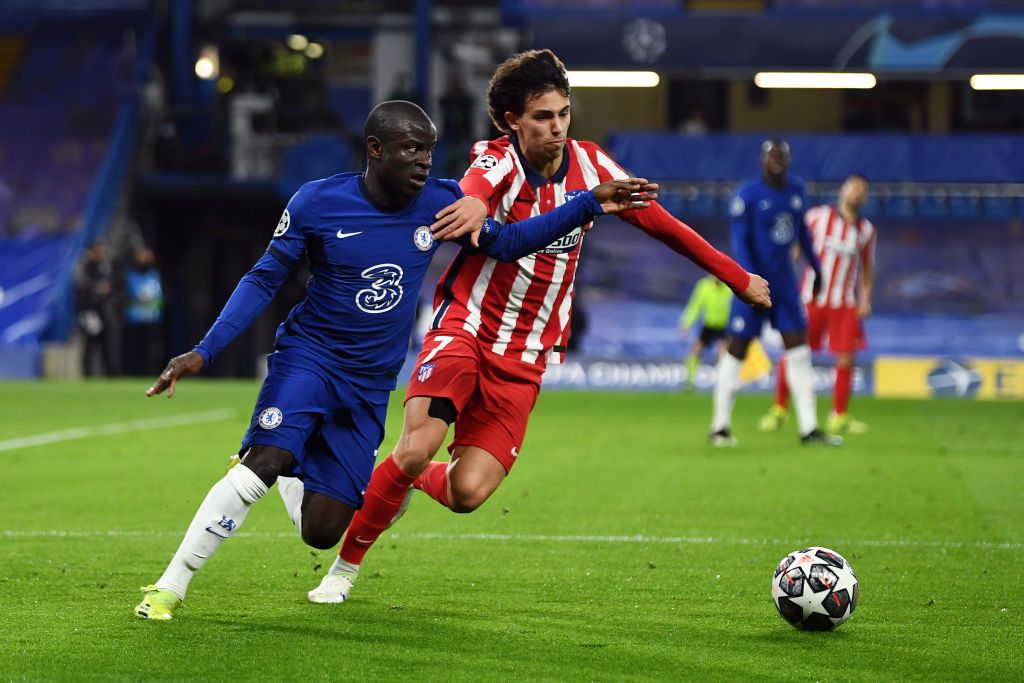 LONDON, ENGLAND - MARCH 17: Ngolo Kante of Chelsea runs with the ball during the UEFA Champions League Round of 16 match between Chelsea FC and Atletico Madrid at Stamford Bridge on March 17, 2021 in London, England. Sporting stadiums around the UK remain under strict restrictions due to the Coronavirus Pandemic as Government social distancing laws prohibit fans inside venues resulting in games being played behind closed doors. (Photo by Mike Hewitt/Getty Images)