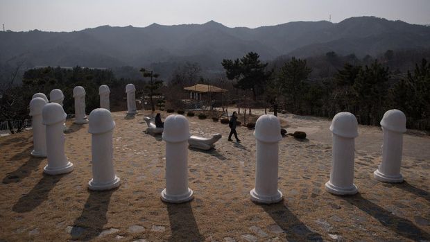 Samcheok Haesindang Park Statues are displayed at the Haesindang 'penis park' in Samcheok on February 14, 2018. - Tucked in a remote spot around 40 miles (60 kilometres) from the Olympic Games venues in Pyeongchang, the phallic mecca boasts dozens of erect penises standing proud and tall. All the family are welcome to Penis Park, says guide Park Se-yeon, a young woman showing off the pick of the park's penises including one full-size penis cannon pointing out over the sea towards Japan -- complete with veined contours. (Photo by Ed JONES / AFP)