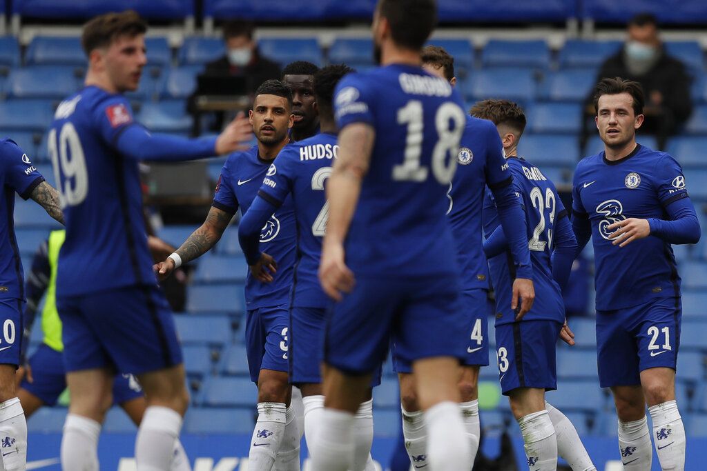 Chelsea players celebrate after Sheffield United's Oliver Norwood scored an own goal during the English FA Cup quarterfinal soccer match between Chelsea and Sheffield United at the Stamford Bridge stadium in London, Sunday, March 21, 2021. (AP Photo/Kirsty Wigglesworth)