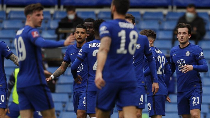 Chelsea players celebrate after Sheffield Uniteds Oliver Norwood scored an own goal during the English FA Cup quarterfinal soccer match between Chelsea and Sheffield United at the Stamford Bridge stadium in London, Sunday, March 21, 2021. (AP Photo/Kirsty Wigglesworth)