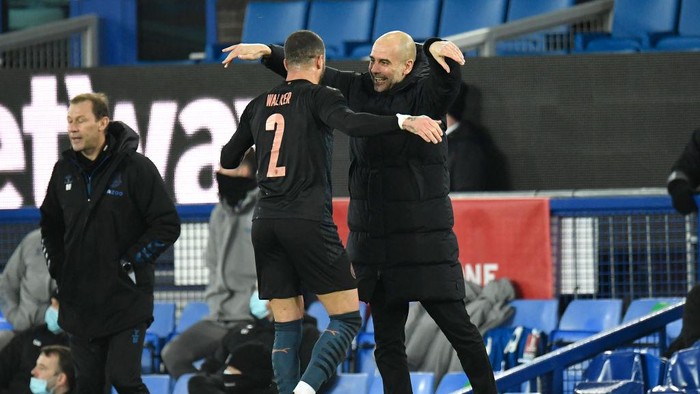 LIVERPOOL, ENGLAND - MARCH 20: Pep Guardiola, Manager of Manchester City celebrates with Kyle Walker of Manchester City after The Emirates FA Cup Quarter Final match between Everton v Manchester City at Goodison Park on March 20, 2021 in Liverpool, England. Sporting stadiums around the UK remain under strict restrictions due to the Coronavirus Pandemic as Government social distancing laws prohibit fans inside venues resulting in games being played behind closed doors. (Photo by Peter Powell - Pool/Getty Images)