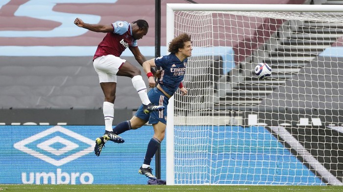 LONDON, ENGLAND - MARCH 21: Michail Antonio of West Ham United shoots before Tomas Soucek of West Ham United (not pictured) scores their sides third goal during the Premier League match between West Ham United and Arsenal at London Stadium on March 21, 2021 in London, England. Sporting stadiums around the UK remain under strict restrictions due to the Coronavirus Pandemic as Government social distancing laws prohibit fans inside venues resulting in games being played behind closed doors.  (Photo by Paul Childs - Pool/Getty Images)