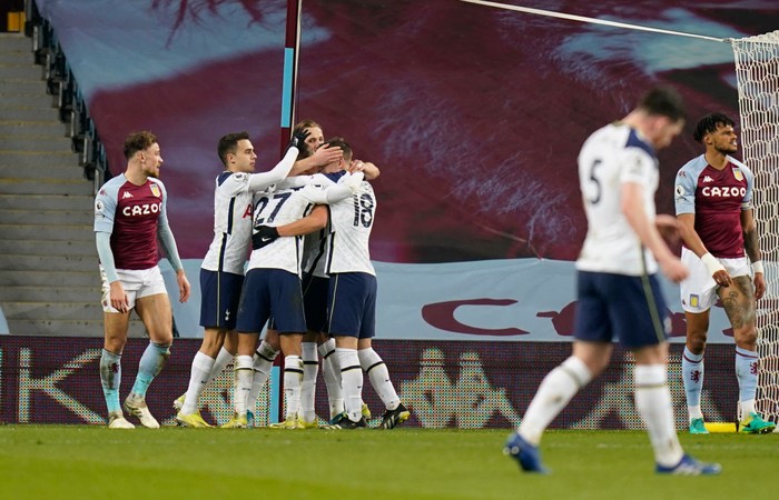 BIRMINGHAM, ENGLAND - MARCH 21: Carlos Vinicius of Tottenham Hotspur (obscured) celebrates with team mates after scoring their sides first goal during the Premier League match between Aston Villa and Tottenham Hotspur at Villa Park on March 21, 2021 in Birmingham, England. Sporting stadiums around England remain under strict restrictions due to the Coronavirus Pandemic as Government social distancing laws prohibit fans inside venues resulting in games being played behind closed doors. (Photo by Tim Keeton - Pool/Getty Images)