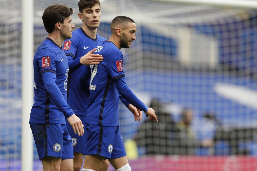 Chelsea's Hakim Ziyech, center, celebrates after scoring his side's second goal during the English FA Cup quarterfinal soccer match between Chelsea and Sheffield United at the Stamford Bridge stadium in London, Sunday, March 21, 2021. (AP Photo/Kirsty Wigglesworth)