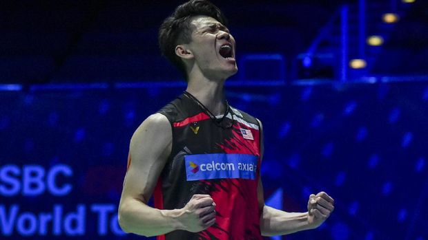 Malaysia's Lee Zii Jia celebrates after winning Denmark's Victor Axelsen during the men's final match of the All England Open Badminton Championships at the Utilita Arena in Birmingham, England, Sunday March 21, 2021. (AP Photo/Rui Vieira)