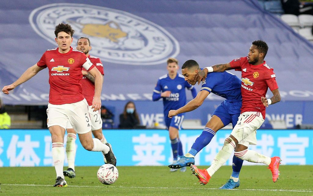 LEICESTER, ENGLAND - MARCH 21: Youri Tielemans of Leicester City scores their side's second goal whilst under pressure from Fred of Manchester United during the Emirates FA Cup Quarter Final match between Leicester City and Manchester United at The King Power Stadium on March 21, 2021 in Leicester, England. Sporting stadiums around the UK remain under strict restrictions due to the Coronavirus Pandemic as Government social distancing laws prohibit fans inside venues resulting in games being played behind closed doors. (Photo by Alex Pantling/Getty Images)