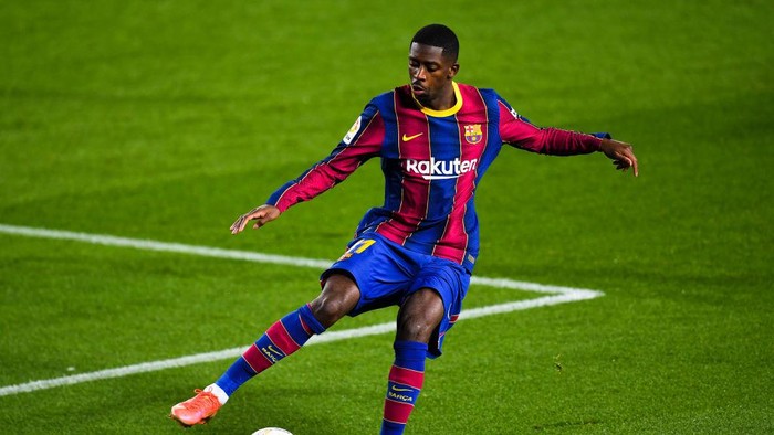 BARCELONA, SPAIN - MARCH 15: Ousmane Dembele of FC Barcelona runs with the ball during the La Liga Santander match between FC Barcelona and SD Huesca at Camp Nou on March 15, 2021 in Barcelona, Spain. Sporting stadiums around Spain remain under strict restrictions due to the Coronavirus Pandemic as Government social distancing laws prohibit fans inside venues resulting in games being played behind closed doors. (Photo by David Ramos/Getty Images)