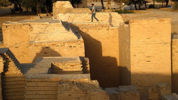 A man visits the archaeological site of Babylon, Iraq, Sunday, March 21, 2021. (AP Photo/Hadi Mizban)
