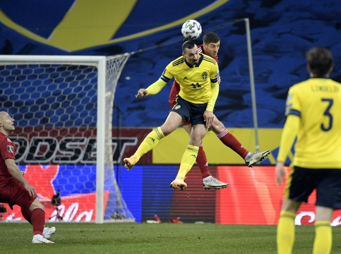 Swedens Zlatan Ibrahimovic, front center, and Georgias Lasha Dvali battle for the ball during World Cup 2022 qualifier group A soccer game between Sweden and Georgia at Friends Arena in Stockholm, Thursday March 25, 2021. (Pontus Lundahl/TT News Agency via AP)