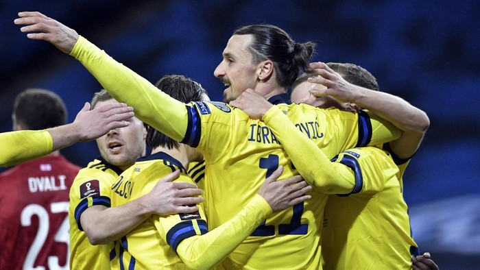 Swedens Zlatan Ibrahimovic, center, celebrates scoring his sides first goal during World Cup 2022 qualifier group A soccer game between Sweden and Georgia at Friends Arena in Stockholm, Thursday March 25, 2021. (Pontus Lundahl/TT News Agency via AP)