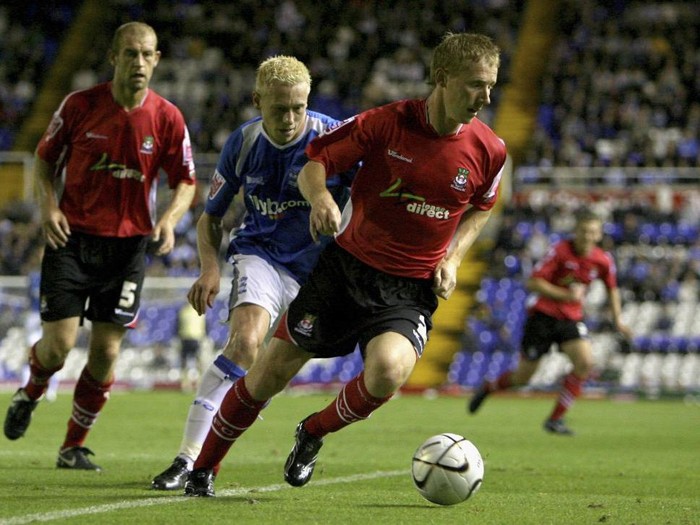 BIRMINGHAM, UNITED KINGDOM - SEPTEMBER 19: Lee Roche of Wrexham in action with Mikael Forssell of Birmingham City during the Carling Cup 2nd round match between  Birmingham City and Wrexham at St Andrews on September 19, 2006 in Birmingham, England.  (Photo by Clive Brunskill/Getty Images)