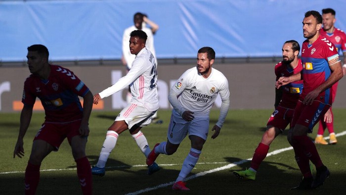 Real Madrids Eden Hazard fights for the ball during the Spanish La Liga soccer match between Real Madrid and Elche at the Alfredo di Stefano stadium in Madrid, Spain, Saturday, March 13, 2021. (AP Photo/Bernat Armangue)