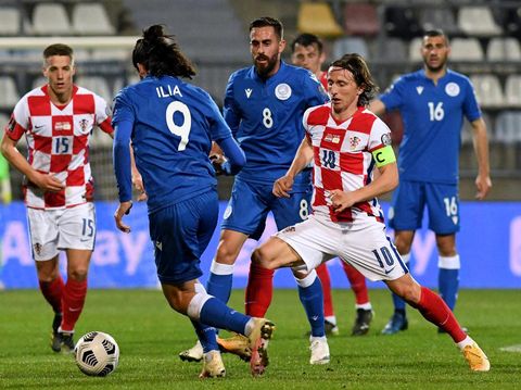 Croatia's midfielder Luka Modric (R) fights for the ball with the Cyprus'  forward Marios Ilia  during the FIFA World Cup Qatar 2022 qualification Group H football match between Croatia and Cyprus at the HNK Rijeka Stadium, in Rijeka, on March 27, 2021. (Photo by Denis LOVROVIC / AFP)