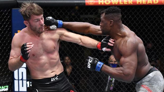 Mar 27, 2021; Las Vegas, NV, USA;   Francis Ngannou of Cameroon punches Stipe Miocic in their UFC heavyweight championship fight during the UFC 260 event at UFC APEX on March 27, 2021 in Las Vegas, Nevada.   Mandatory Credit: Jeff Bottari/Handout Photo via USA TODAY Sports