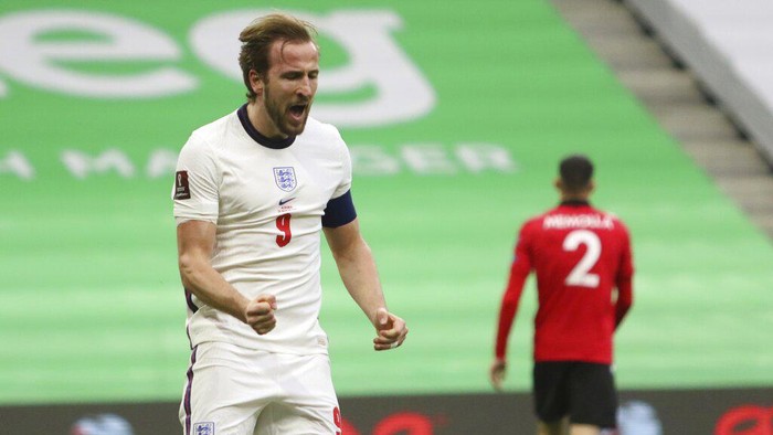Englands Harry Kane celebrates his sides first goal during the World Cup 2022 group I qualifying soccer match between Albania and England at Air Albania stadium in Tirana, Sunday, March 28, 2021. England won 2-0. (AP Photo/Hektor Pustina)